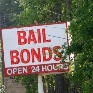 Sign that says "Bail bonds, open 24 hours"