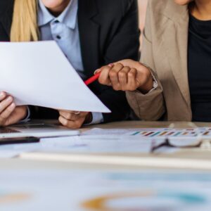 Two people looking at a document