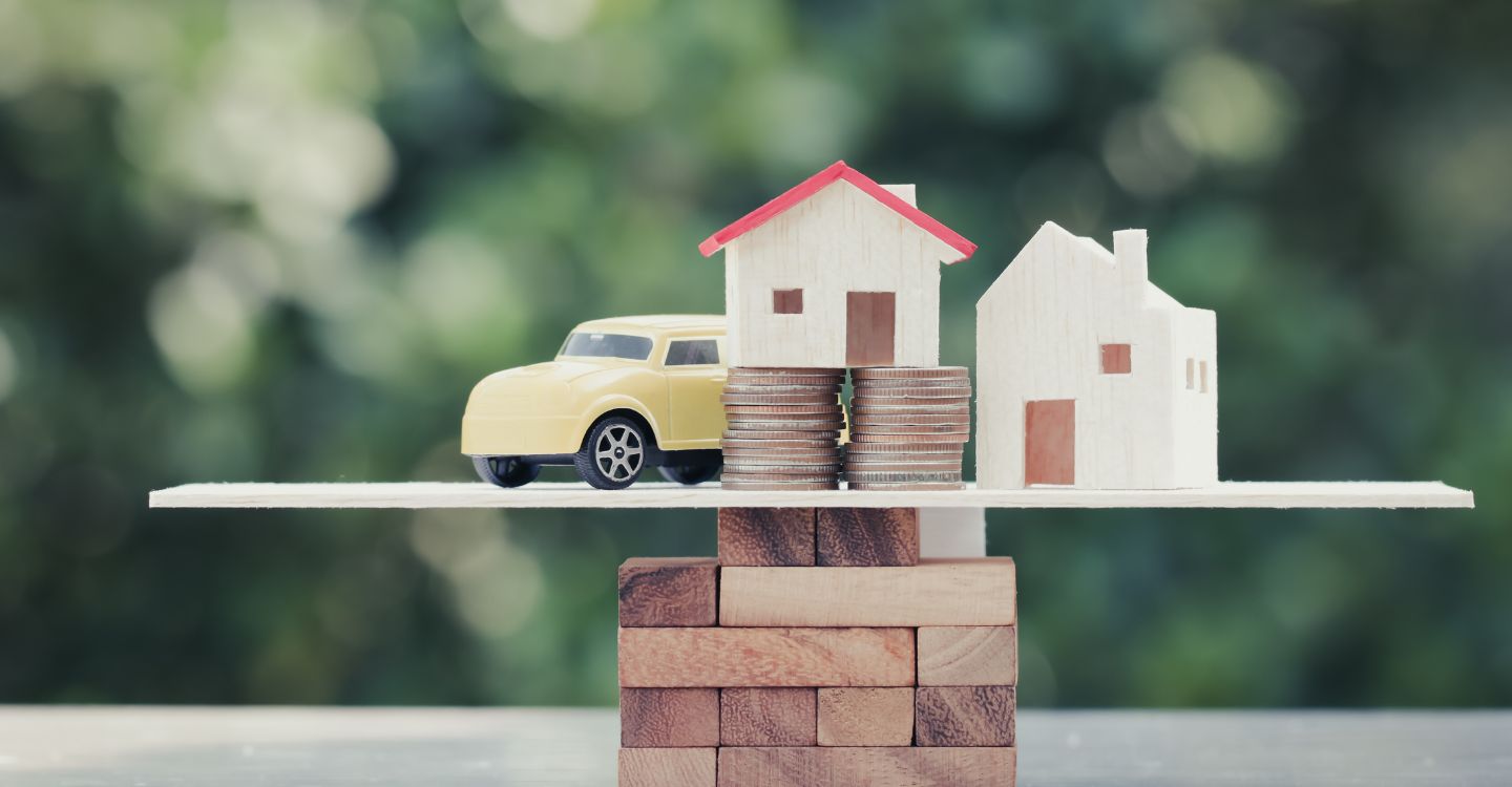 a toy car, homes, and coins