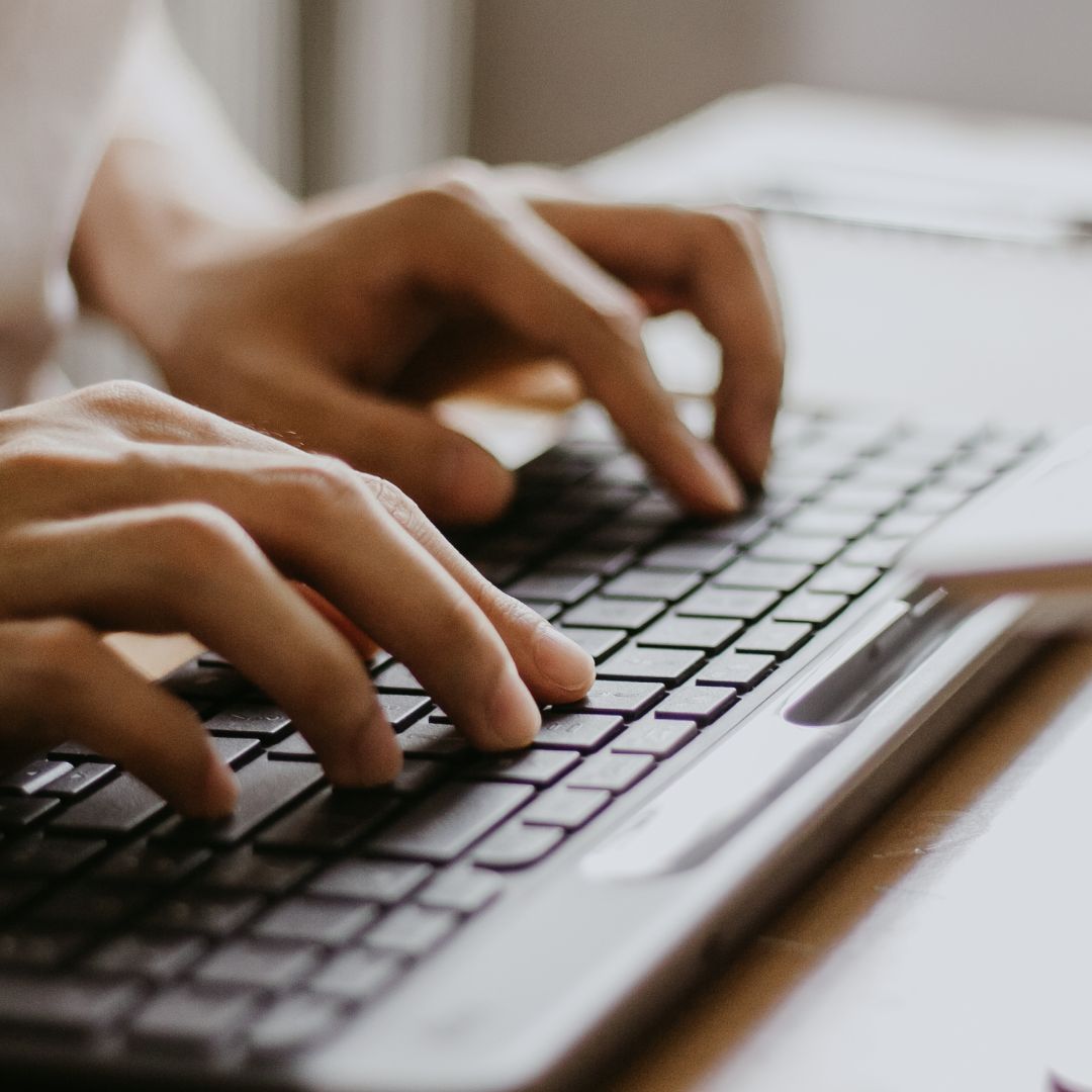 Persons hands while typing