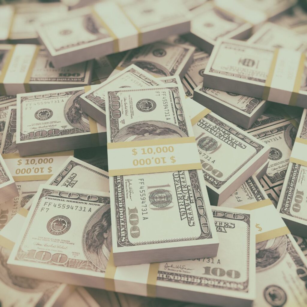 a large stack of banded bills