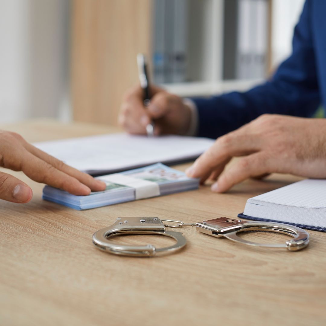 A man signing bond paperwork
