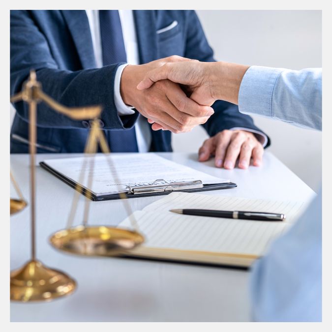 two people shaking hands with a scale near by